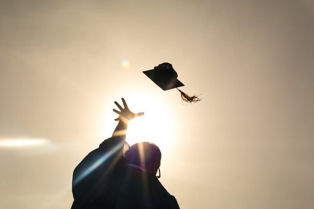 Choosing A College: 4 Important Things To Consider 2 choosing a college: graduate throws hat in the air